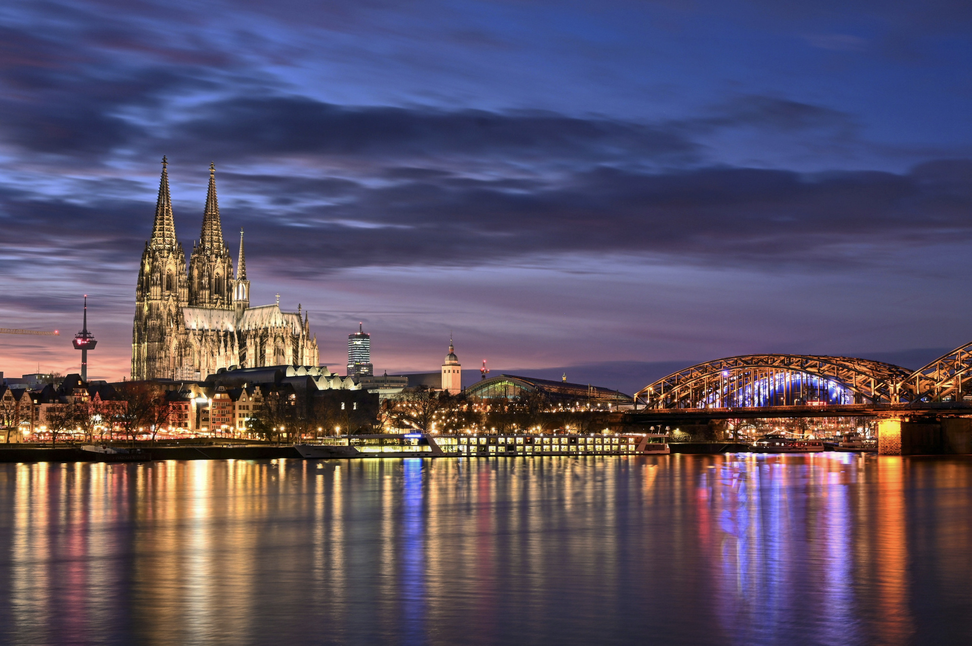Cologne Cathedral and Hohenzollern Bridge at dusk